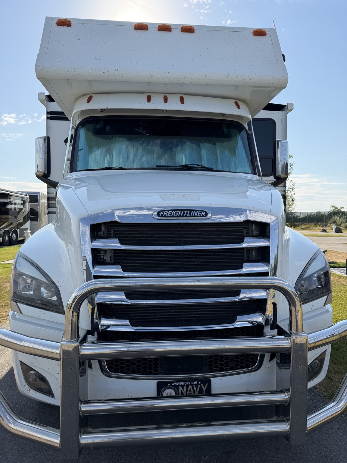 Motorhome front before detailing with visible bugs and road grime